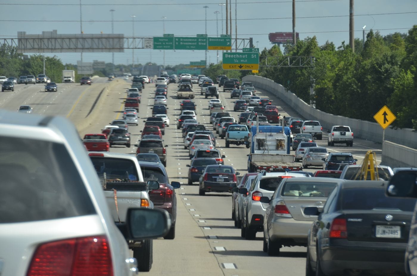 Cars traveling on an urban road; editorial photography